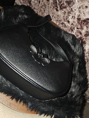 Black Leather Shoulder Bag with Floral Accent